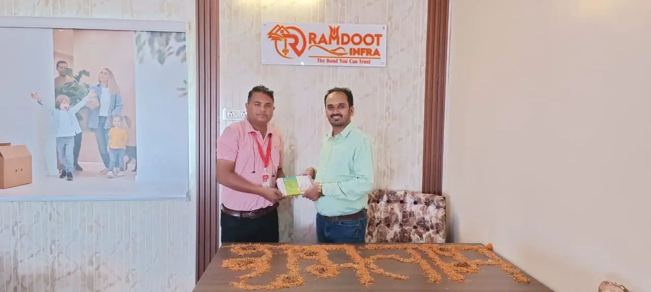 Clients receiving plot documents from Ramdoot Infra owner