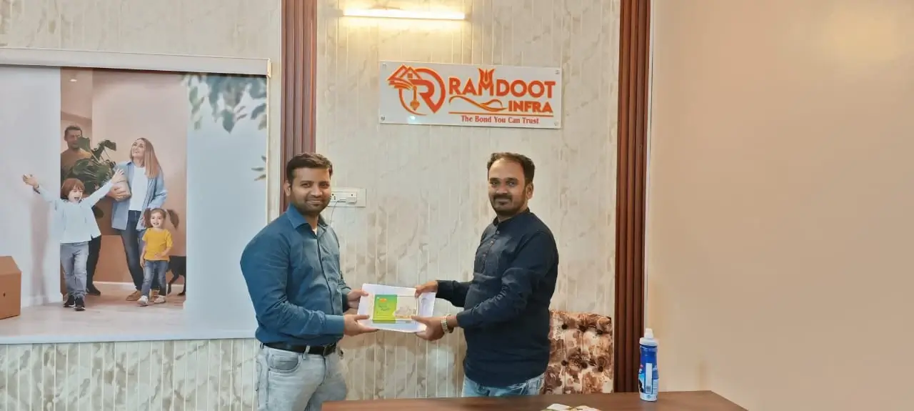 Property buyers celebrating their new investment at Ramdoot Infra