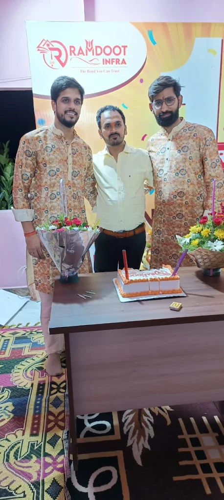 Satisfied home buyers receiving property documents Ramdoot Infra