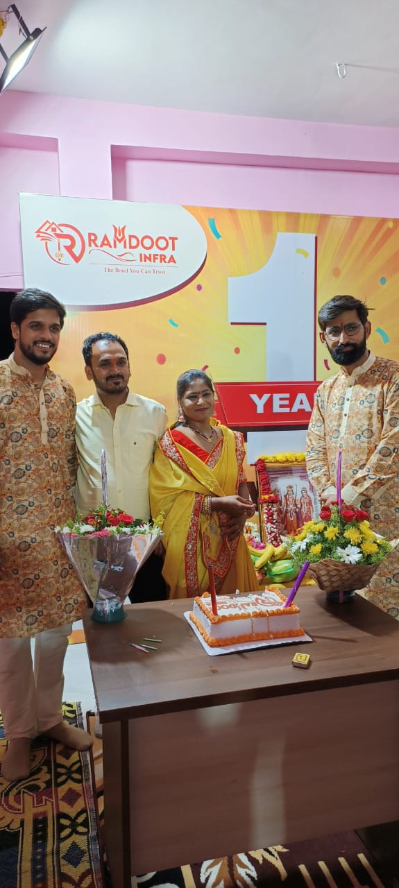 Satisfied home buyers receiving property documents Ramdoot Infra